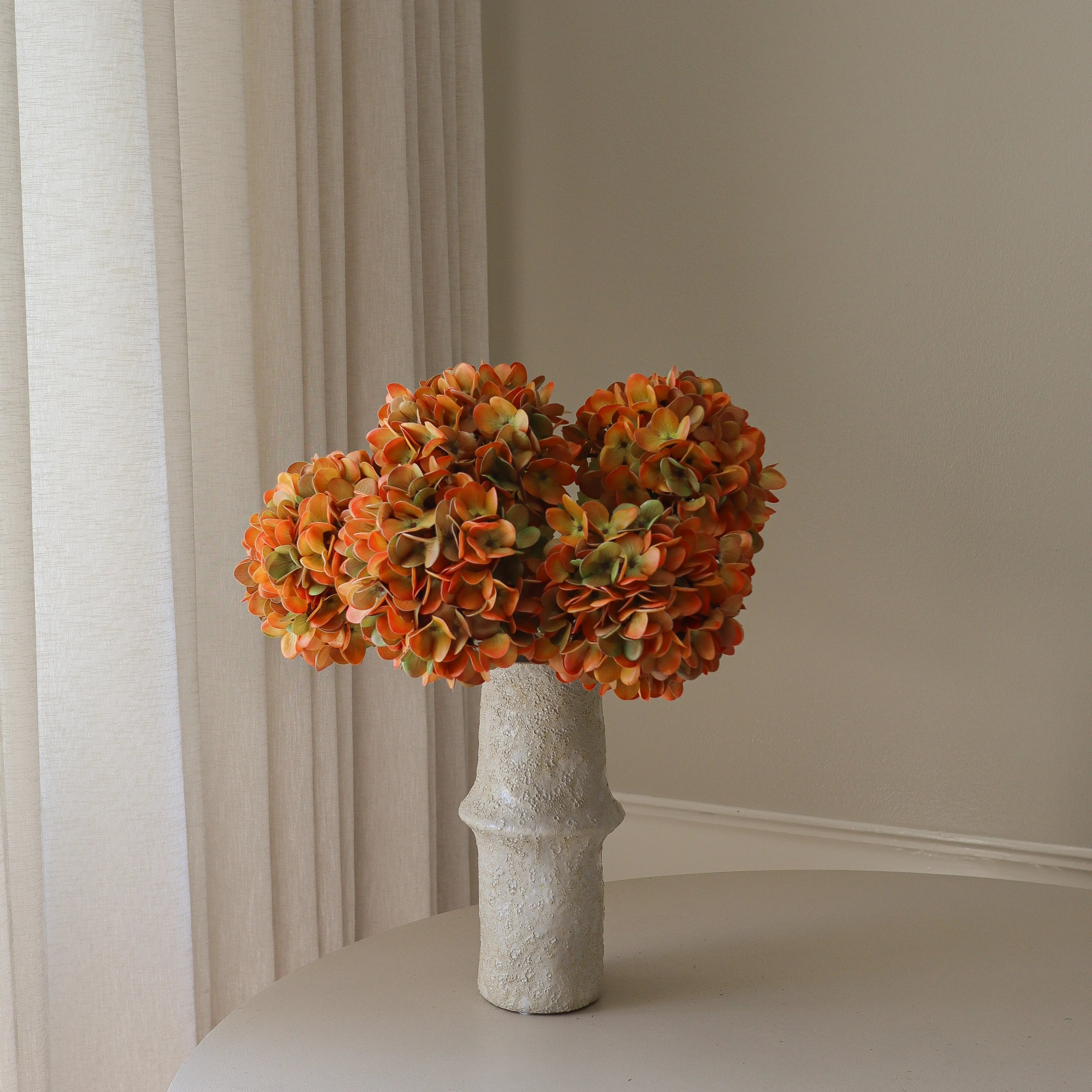 Muted Orange Hydrangea Bouquet Met Large Earth