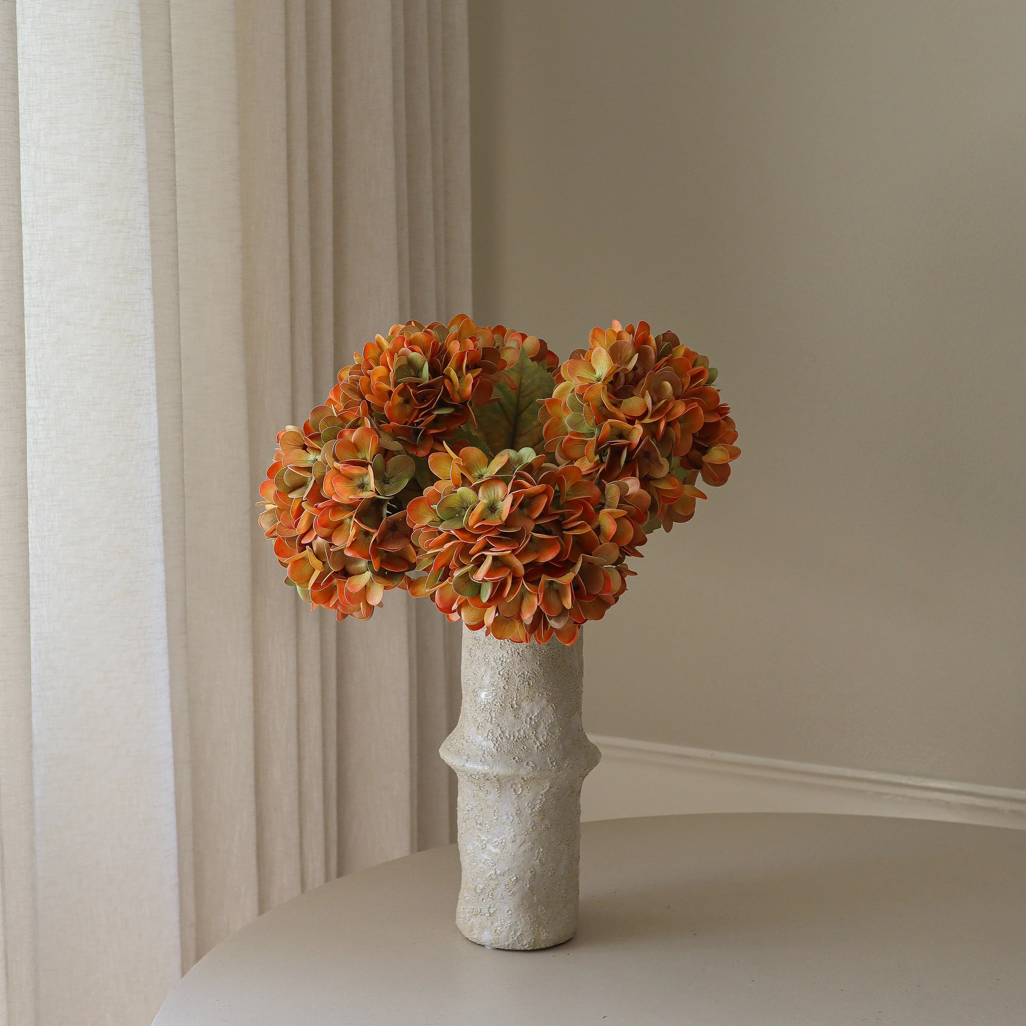 Muted Orange Hydrangea Bouquet Met Large Earth